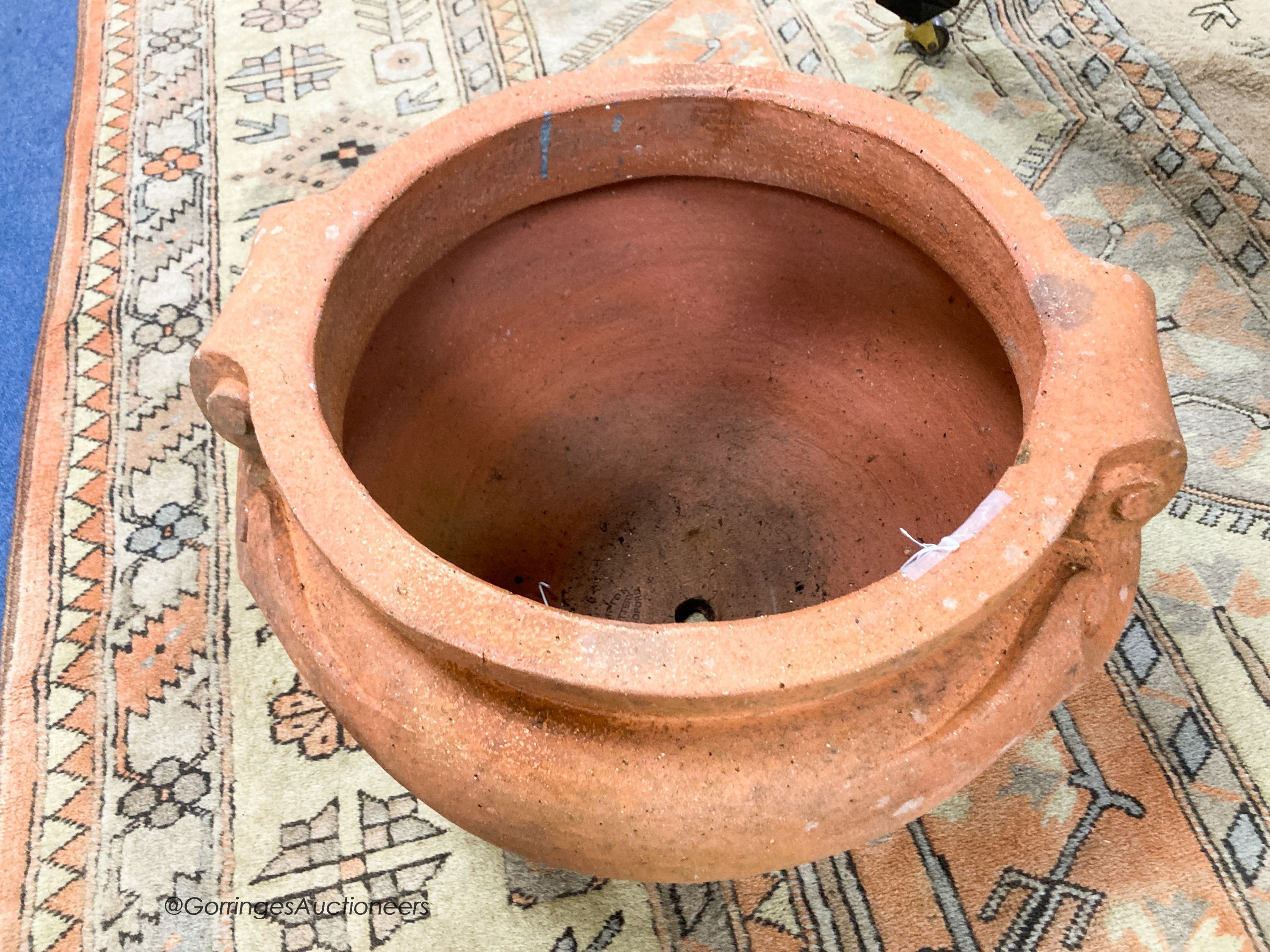 A Compton pottery terracotta scroll garden planter, impress marks, 50cm diameter, height 37cm